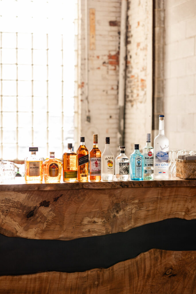 raw edge wood bar located in the butterfly room a industrial venue